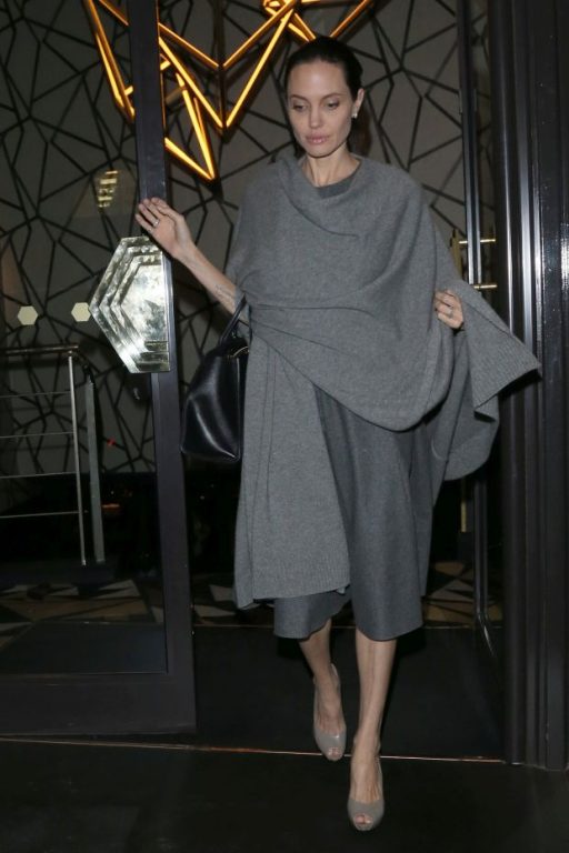 Angelina Jolie pictured leaving Quaglino's Restaurant in Mayfair after dining with William Hague. They had arrived at 8pm and Angelian left via the front exit at 2215 while William Hague slipped away quietly through another doorPictured: Angelina Jol