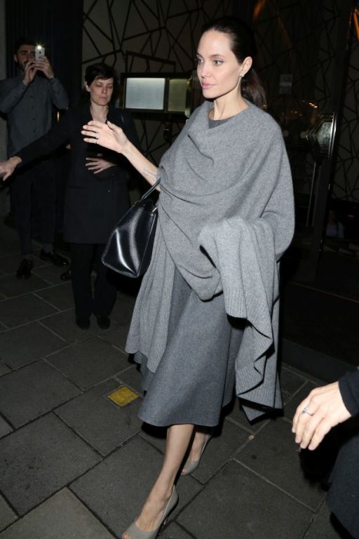 Angelina Jolie pictured leaving Quaglino's Restaurant in Mayfair after dining with William Hague. They had arrived at 8pm and Angelian left via the front exit at 2215 while William Hague slipped away quietly through another doorPictured: Angelina Jol