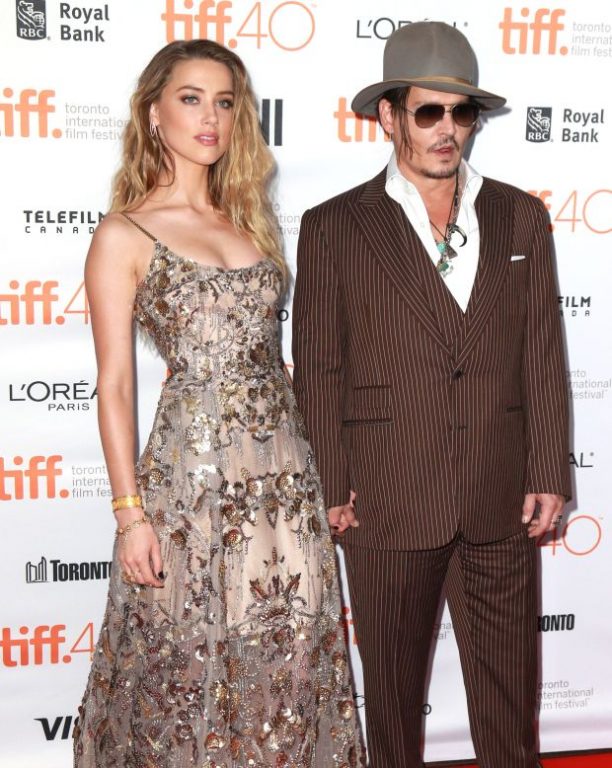 Johnny Depp and Amber Heard at 'The Danish Girl' premiere at TIFF in Toronto, Canada.Pictured: Amber Heard, Johnny DeppRef: SPL1124311 120915 Picture by: Splash NewsSplash News and PicturesLos Angeles: 310-8