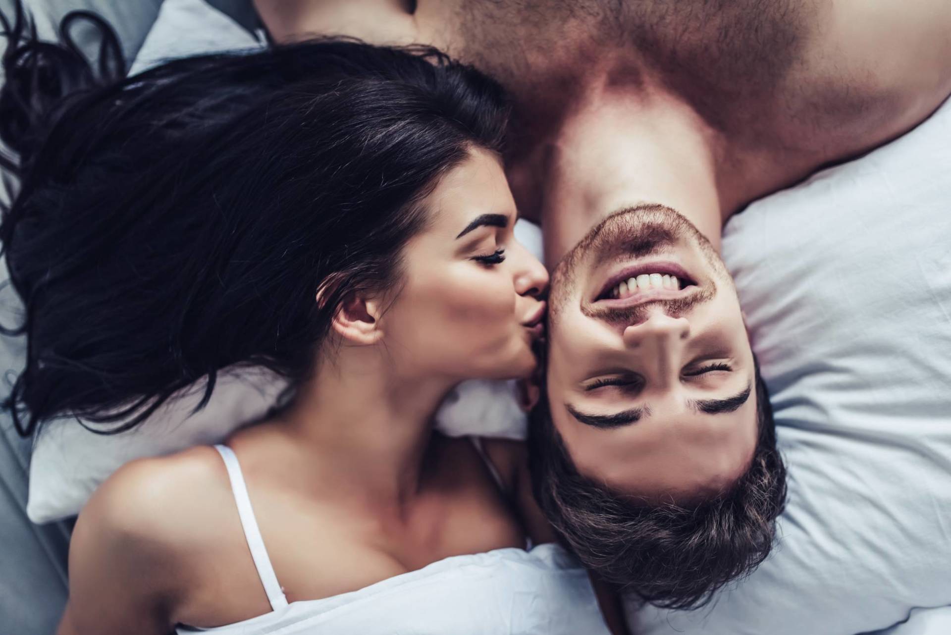 Close Up,of,happy,couple,is,lying,in,bed,together.,enjoying