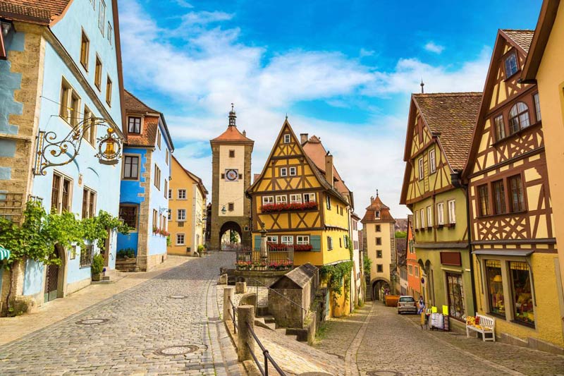 Medieval Old Street In Rothenburg Ob Der Tauber In A Beautiful Summer Day Germany