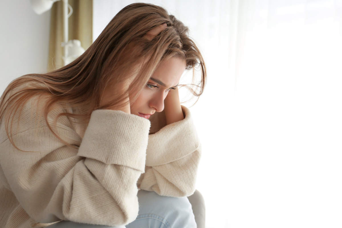 Portrait Of Depressed Woman At Home