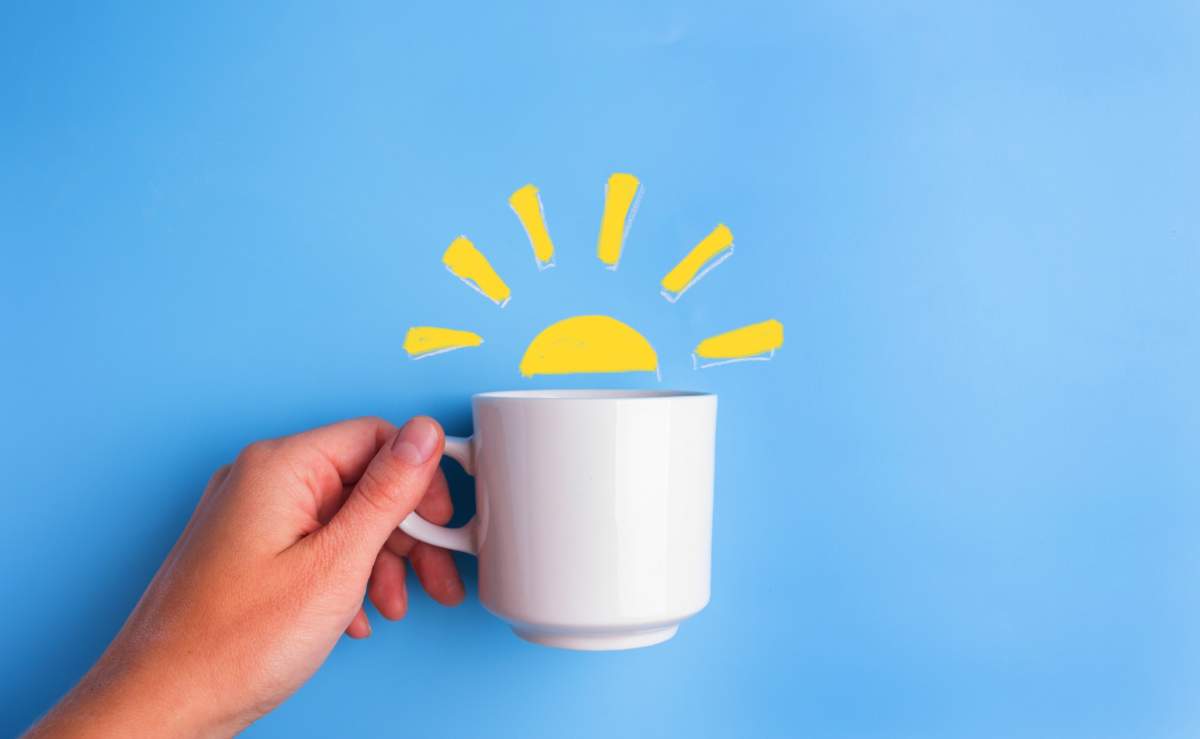 Sun And White Cup On Blue Background