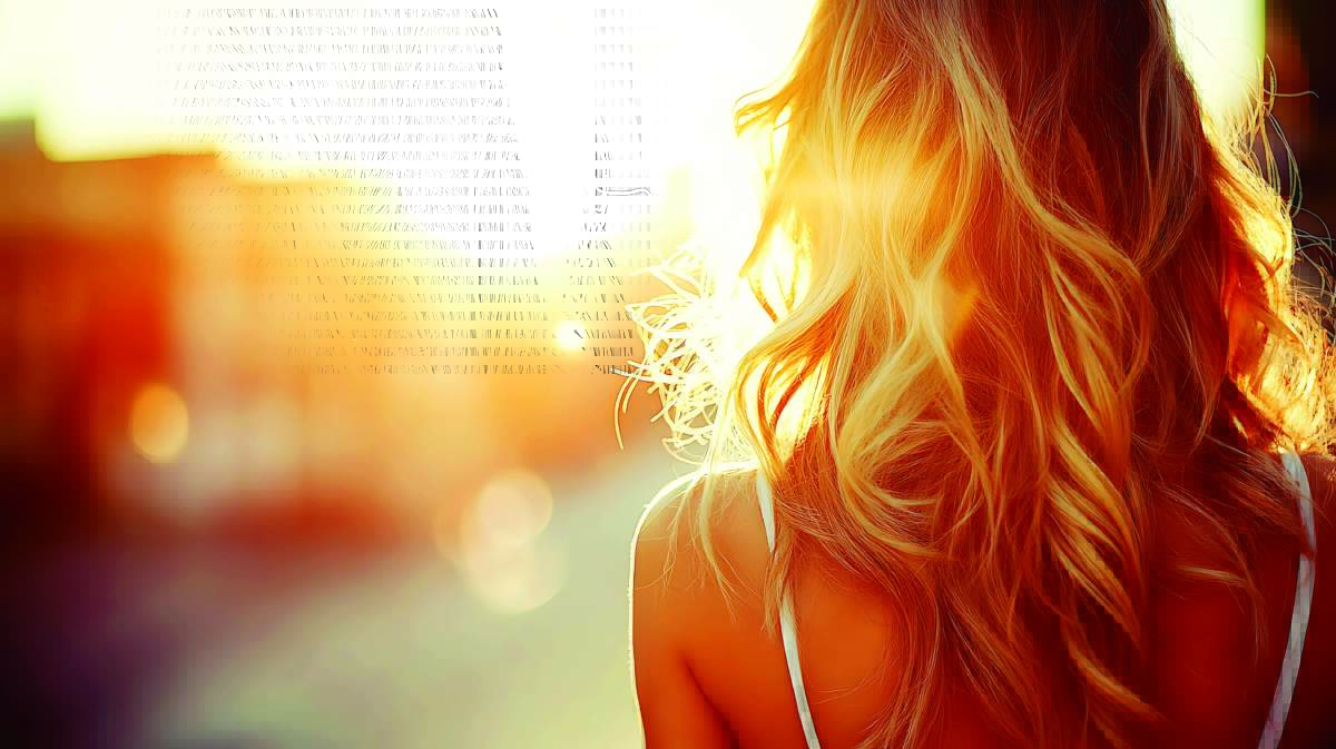 Woman With Blonde Hair Backlit By Sunset.
