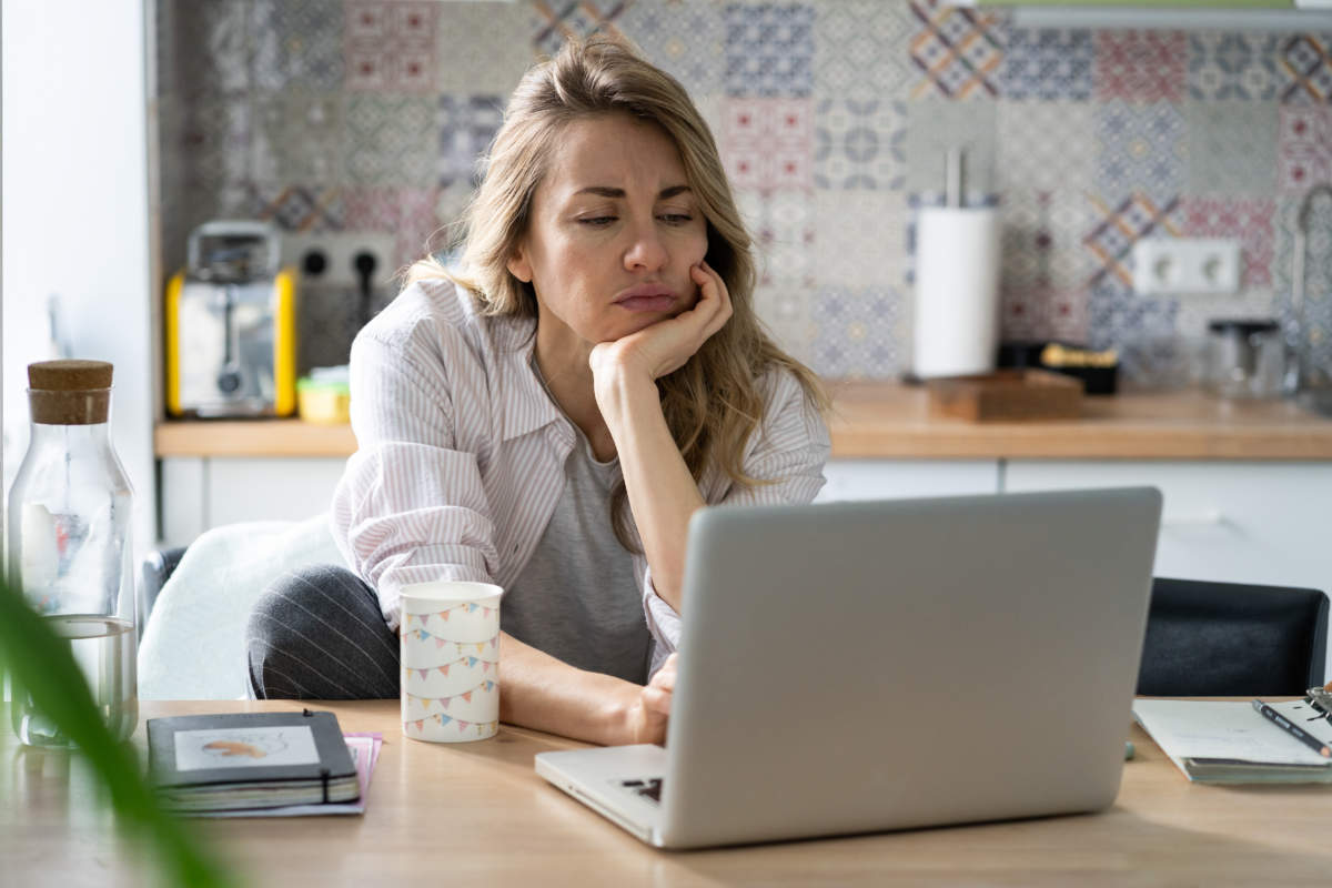 Displeased Woman Of Middle Age Search For New Job Unemployed During Covid 19 Quarantine On Laptop