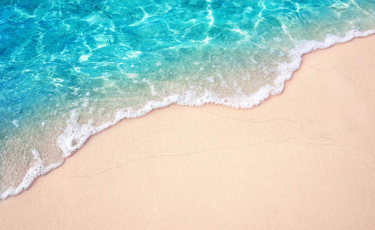 Beautiful Soft Blue Ocean Wave On Fine Sandy Beach