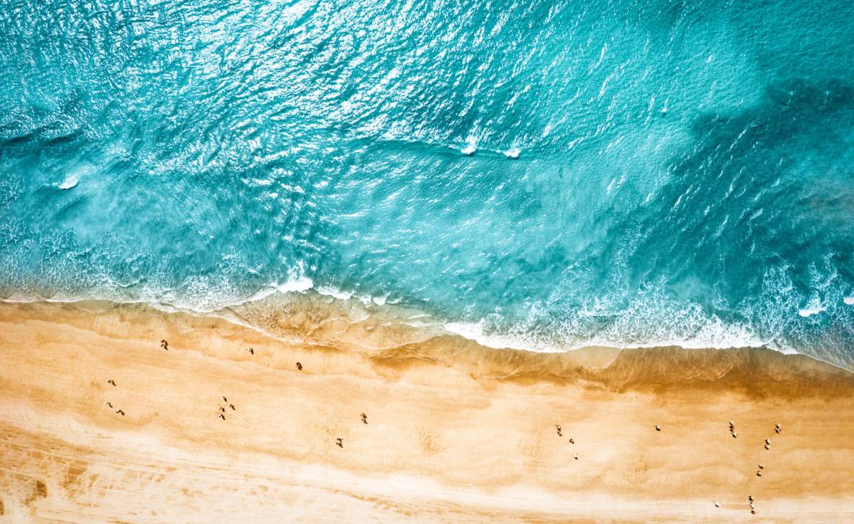 Aerial Photo Of Summer Beach And Blue Ocean With Sky.