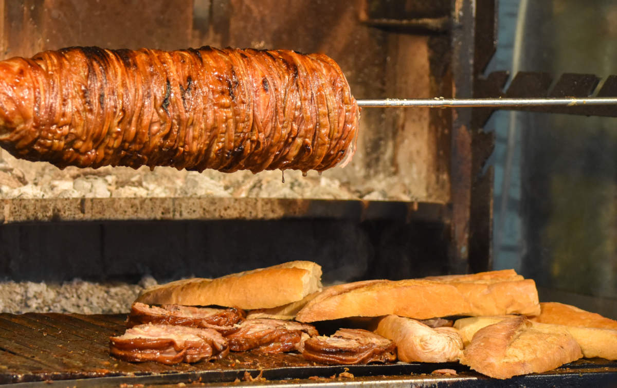 Kokorec (kokorech) Roasting On The Open Fire. Traditional Turkish Food Cooking The Street Food.
