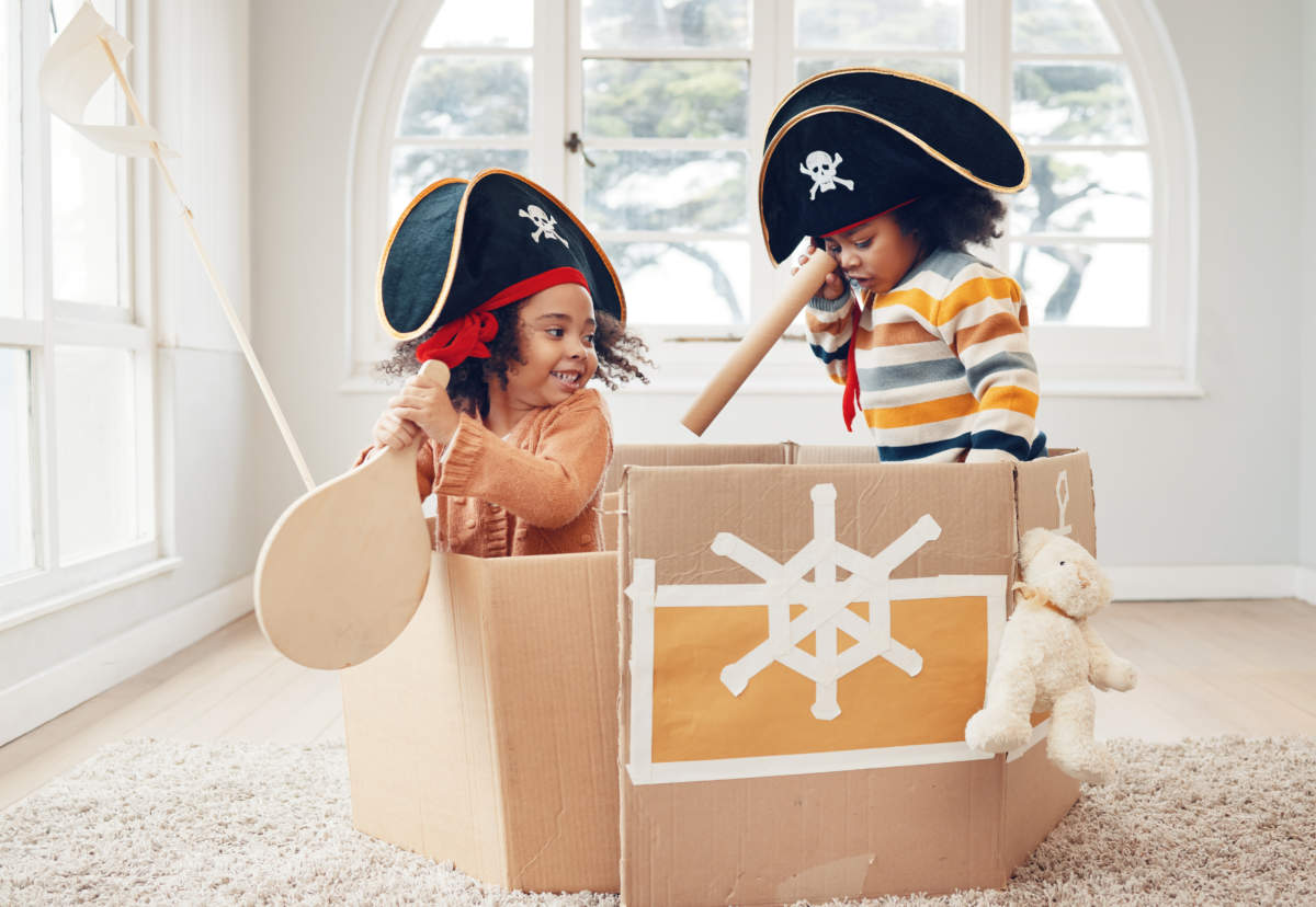 Playing, Box Ship And Pirate Kids Role Play, Fantasy Imagine Or Pretend As Yacht Captain In Cardboard Container. Creative Sailor, Fun Home Game Or Sailing Black Children On Halloween Cruise Adventure