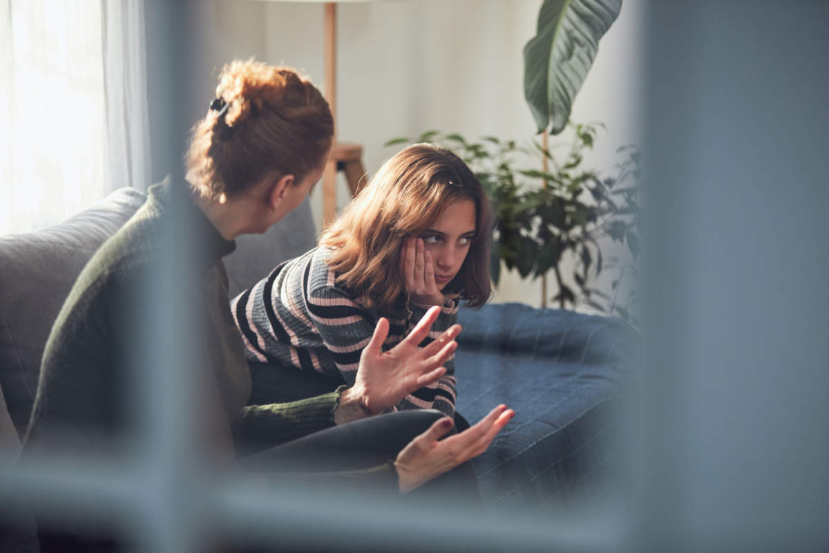 Teenage Girl In Difficult Mood With Angry Mom.