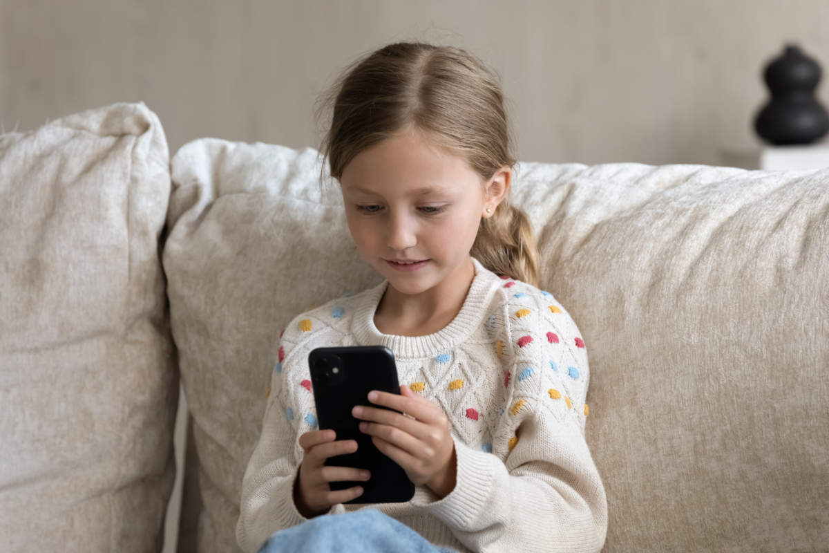 Digital Addicted Kid Engaged In Smartphone Using, Watching Media