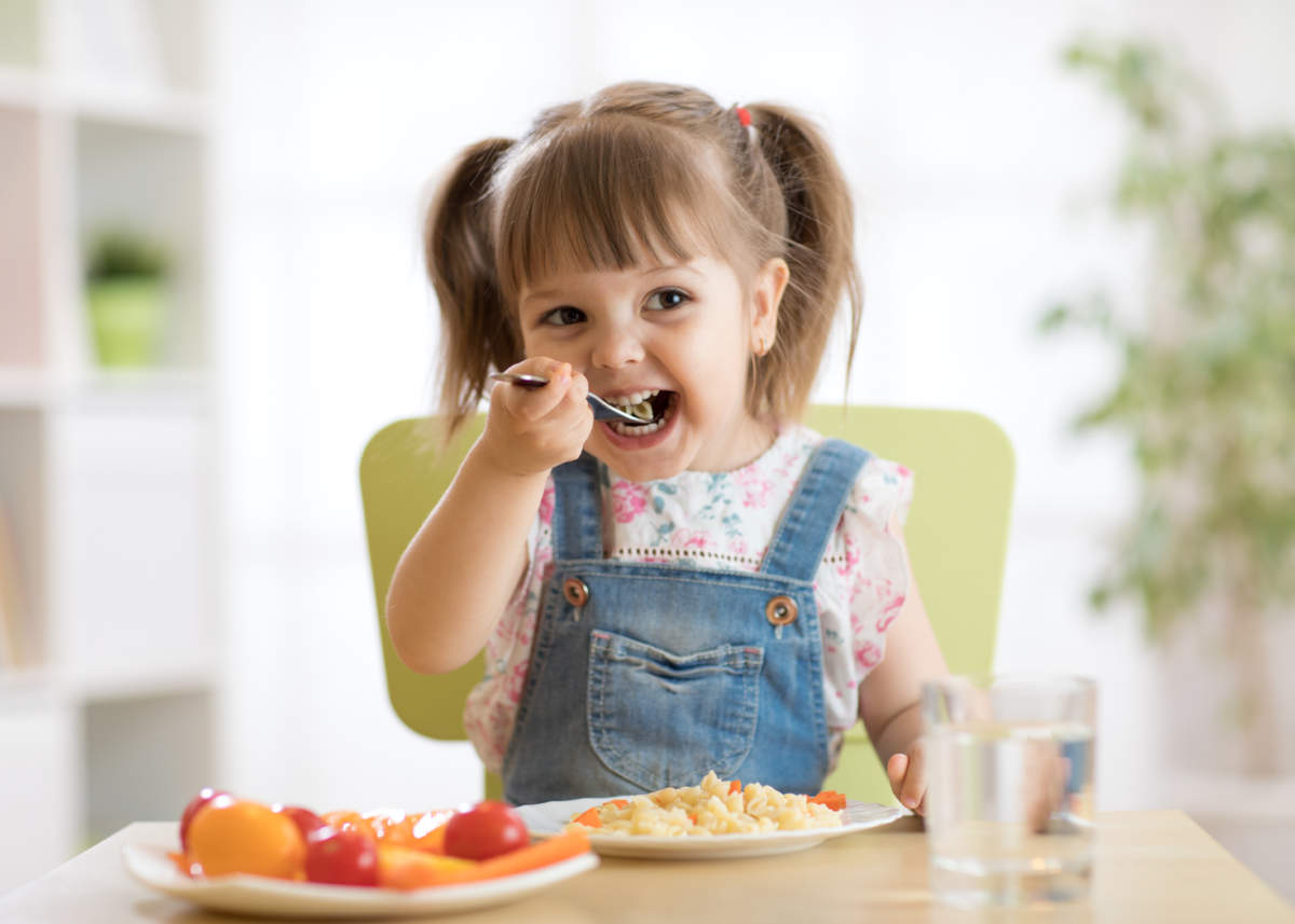 Kid Girl Eating Healthy Food At Home