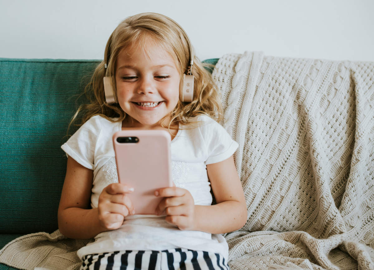 Little Girl Watching Cartoons On Her Phone