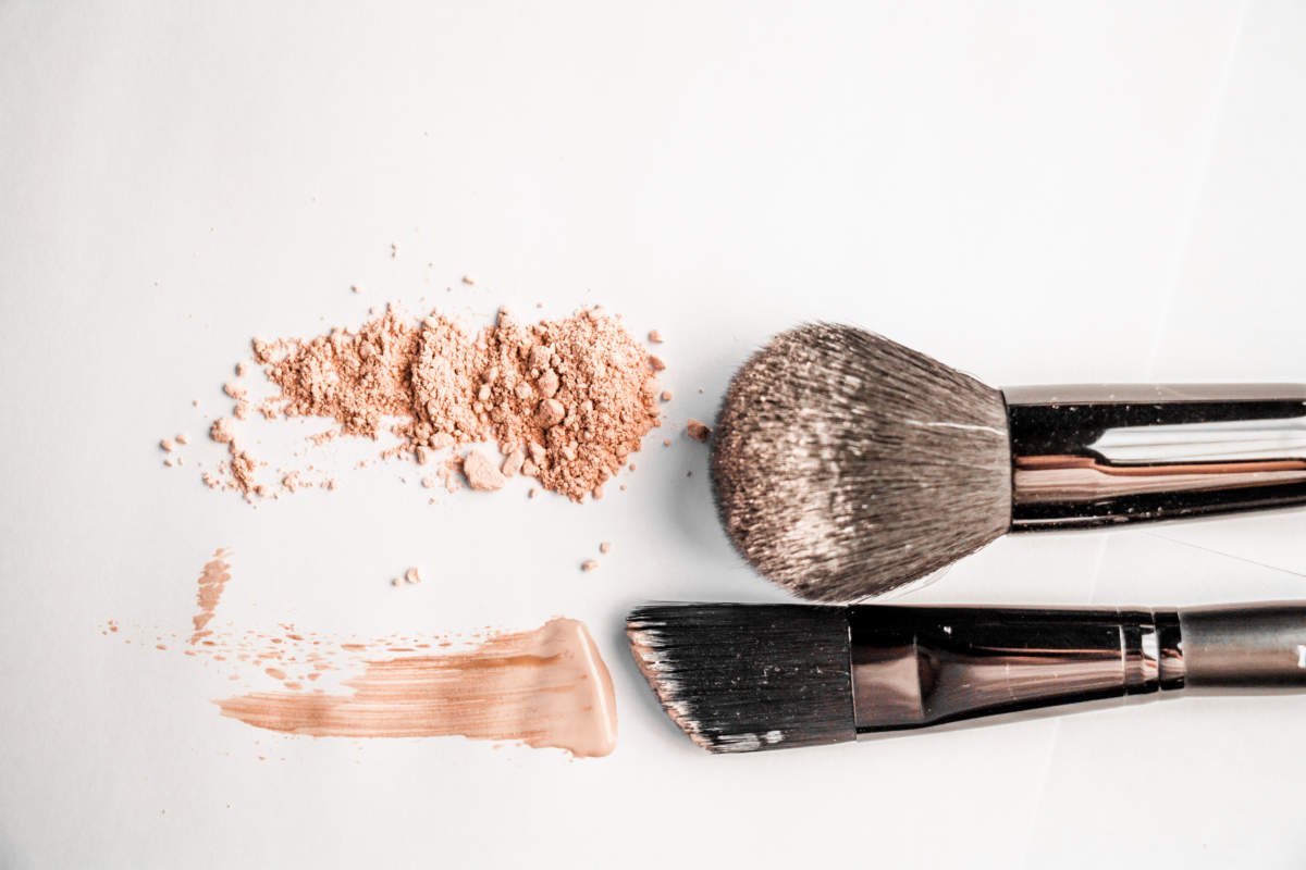 Powder Slide, A Touch Of Foundation And Two Black Makeup Brushes