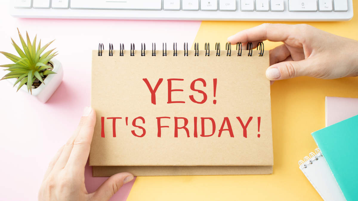 Notepad With The Words Yes. Its Friday. In The Hands Of An Employee Against The Background Of The Office Table